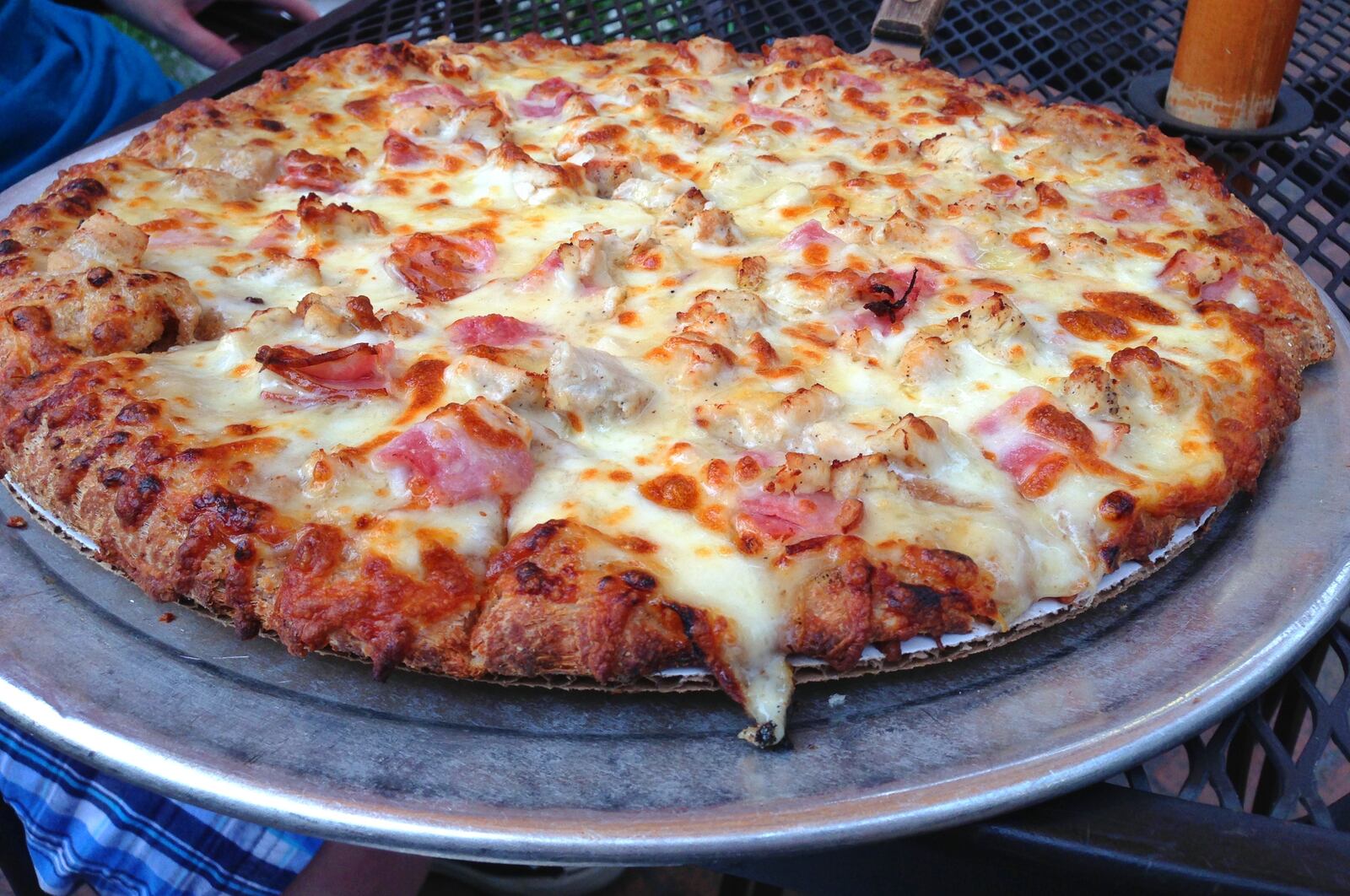 Look at that melty cheese! Chicken Cordon Bleu gourmet pizza is made by scratch and baked in a stone oven at South Park Tavern. (Staff photo by Connie Post)