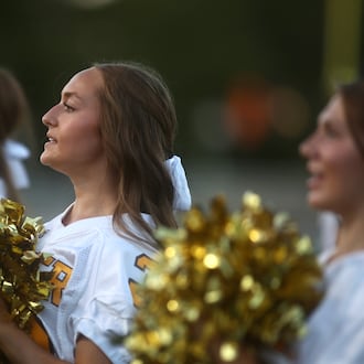Alter cheerleaders perform during a game against Trotwood-Madison on Friday, Sept. 12, 2025, at Roush Stadium in Kettering. David Jablonski/Staff