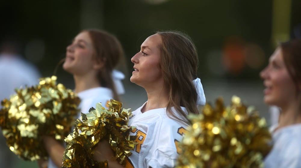 Alter cheerleaders perform during a game against Trotwood-Madison on Friday, Sept. 12, 2025, at Roush Stadium in Kettering. David Jablonski/Staff