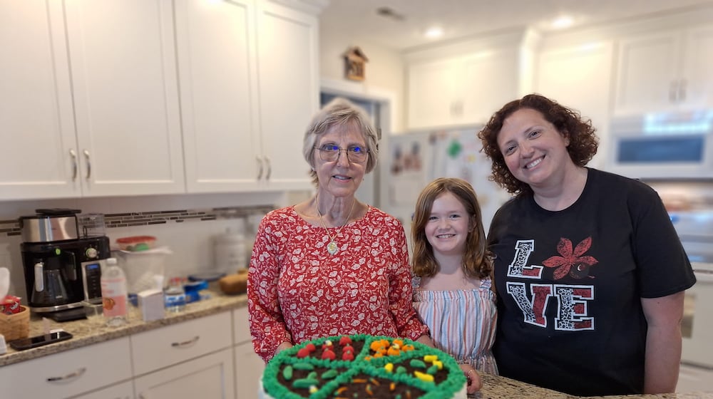 Preparing for the Ohio State Fair in a one-day baking marathon are
(left to right) Christine Olinsky, her granddaughter Anna and her daughter Rebecca. 
CONTRIBUTED