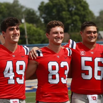 Dayton's Andrew Yanoshak (83) poses for a photo with teammates on Media Day on Sunday, Aug. 17, 2025, at Welcome Stadium. David Jablonski/Staff