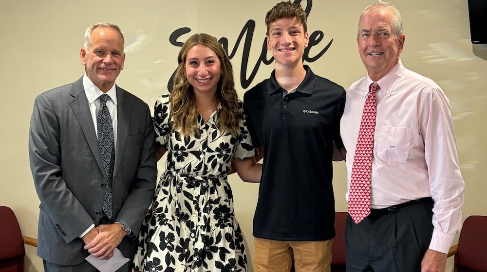 Dentist and Hundred Club of Miami County co-founder Dr. Thomas Grabeman (far right), along with co-founder Kevin Harlan (far left), pictured with siblings Mackenzie and Landon Misirian, the first two people to receive scholarships from the Hundred Club of Miami County in 2024. The group was founded in 2023. CONTRIBUTED