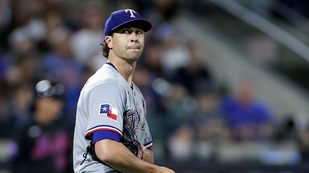 Texas Rangers pitcher Jacob deGrom reacts during the fifth inning of a baseball game against the New York Mets, Friday, Sept. 12, 2025, in New York. (AP Photo/Adam Hunger)
