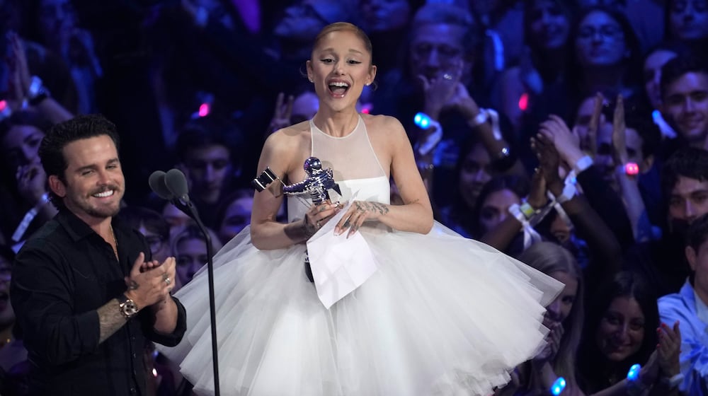 Christian Breslauer, left, and Ariana Grande accept the award for video of the year for "Brighter Days Ahead" during the MTV Video Music Awards on Sunday, Sept. 7, 2025, at UBS Arena in Elmont, N.Y. (Photo by Charles Sykes/Invision/AP)