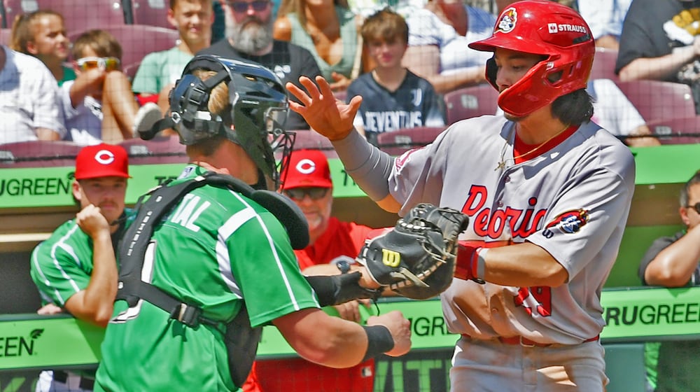 Dragons catcher Ryan McCrystal tags out Jon Jon Gazdar in a third-inning rundown to help the Dragons beat Peoria 3-2 in 11 innings on Sunday, Aug. 25 at Day Air Ballpark. JEFF GILBERT/CONTRIBUTED