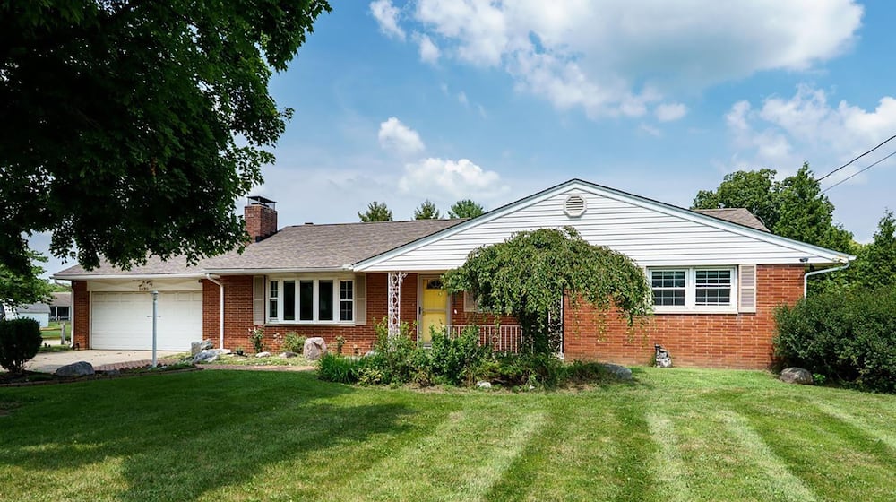 This 1960 brick ranch has been mostly updated and features hardwood flooring throughout, two woodburning fireplaces, three bedrooms and two full bathrooms and a partially finished basement. CONTRIBUTED