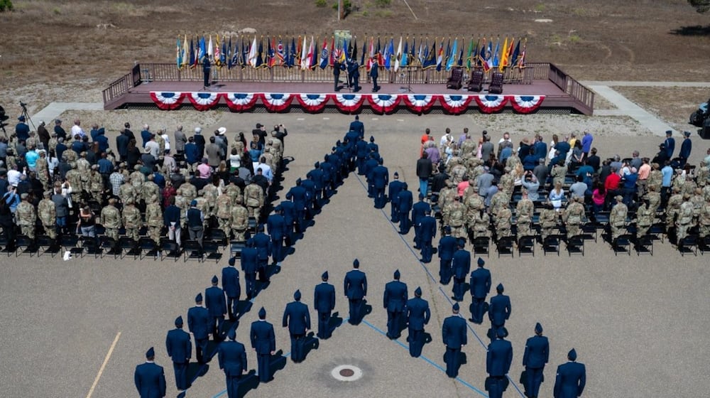 U.S. Space Force Col. James T. Horne III, incoming Space Launch Delta 30 commander, receives the SLD 30 guidon from U.S. Space Force Lt. Gen. Philip Garrant, Space Systems Command commander, during the SLD 30 change of command ceremony at Vandenberg Space Force Base, Calif., July 8, 2025. Space Force photo by Senior Airman Ryan Quijas