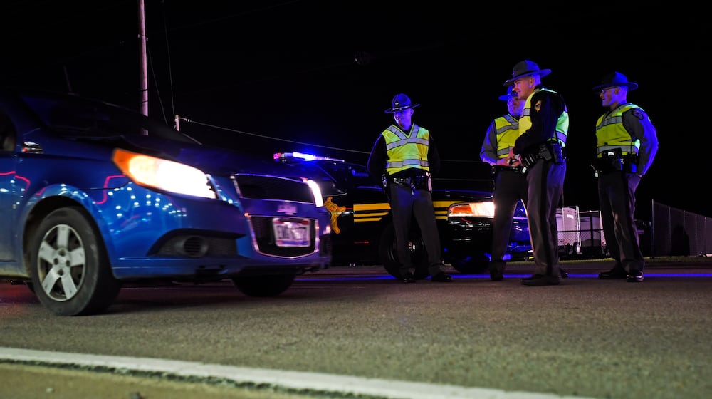 The Butler County OVI Task Force along with the Ohio State Highway Patrol, the Butler County Sheriff’s office and other local law enforcement agencies set up a sobriety checkpoint to check for impaired drivers Friday, Nov. 20 on US-127 in New Miami. NICK GRAHAM/STAFF