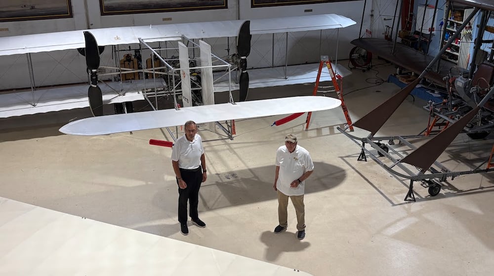 Don Adams, left, president of Wright "B" Flyer Inc., with Jim Papa, chair of the Wright "B" Flyer Board of Trustees, at the Wright "B" Flyer Museum in Miami Twp. THOAMS GNAU/STAFF