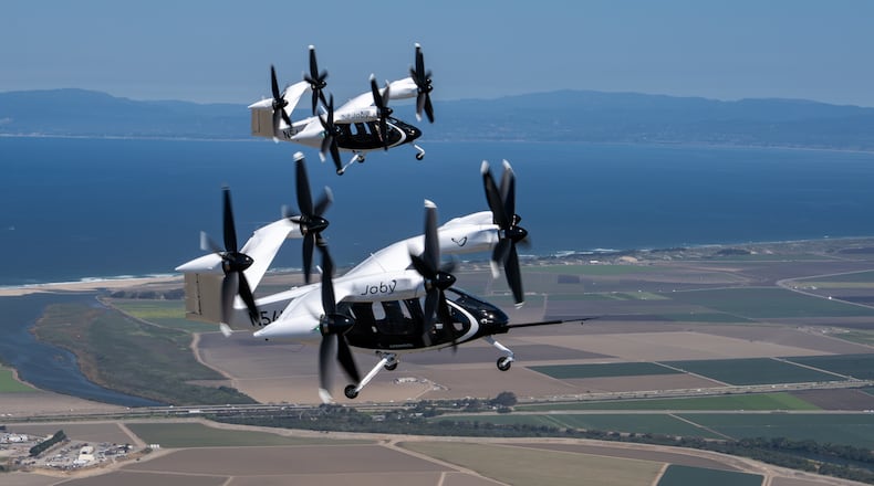 Two Joby air taxis (N541JX and N544JX) flying simultaneously in the skies over Marina, CA. Joby Aviation photo