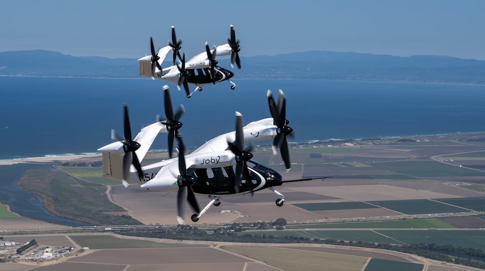 Two Joby air taxis (N541JX and N544JX) flying simultaneously in the skies over Marina, CA. Joby Aviation photo
