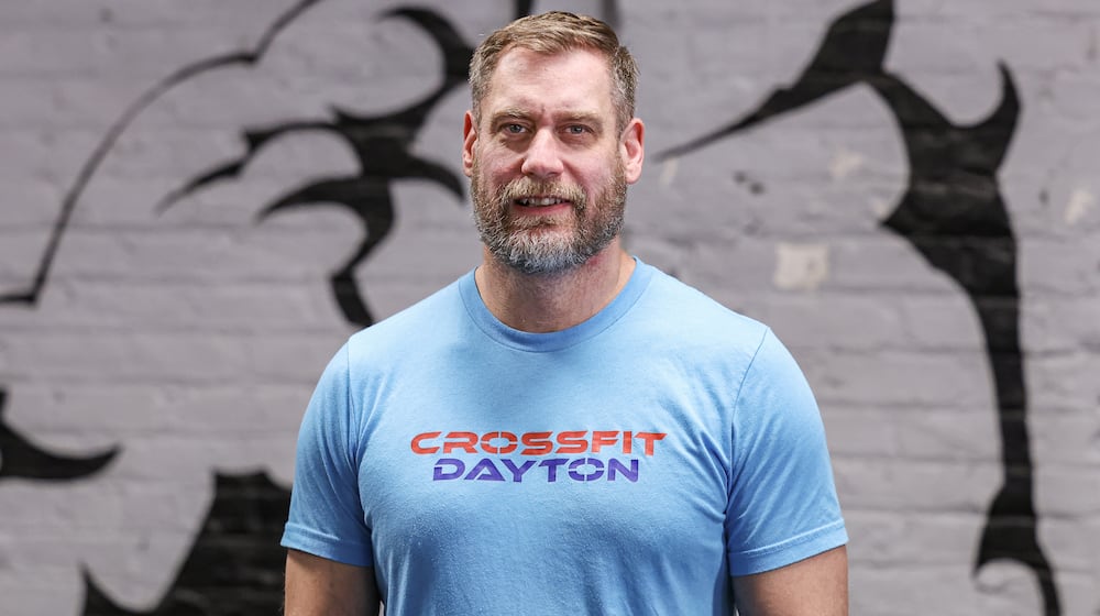 Corey Harman has been named a Dayton Daily News Community Gem for his work as the gym manager and head coach at CrossFit Dayton. BRYANT BILLING / STAFF