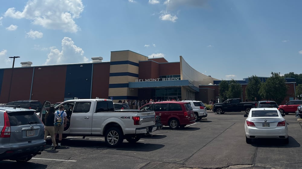 Cars line up outside of Belmont High School in East Dayton to pick up students after school on Friday, Aug. 15. Eileen McClory / Staff