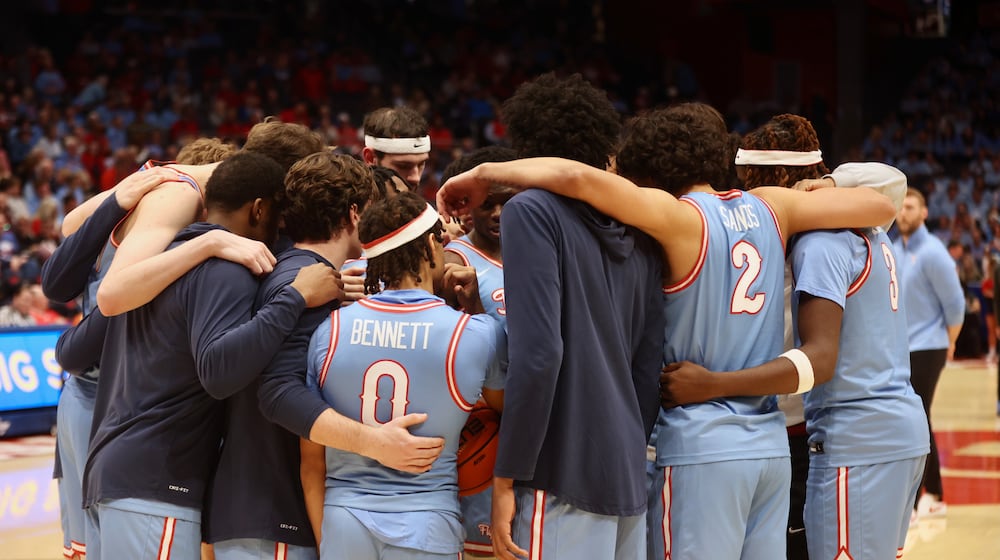 Dayton huddles during a game against Saint Louis on Tuesday, March 4, 2025, at UD Arena. David Jablonski/Staff