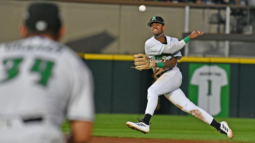 Shortstop Alexander Vargas fires a throw to first baseman Carter Graham on a throw that was late after the ball hit off the pitcher Wednesday night at Day Air Ballpark. JEFF GILBERT/CONTRIBUTED