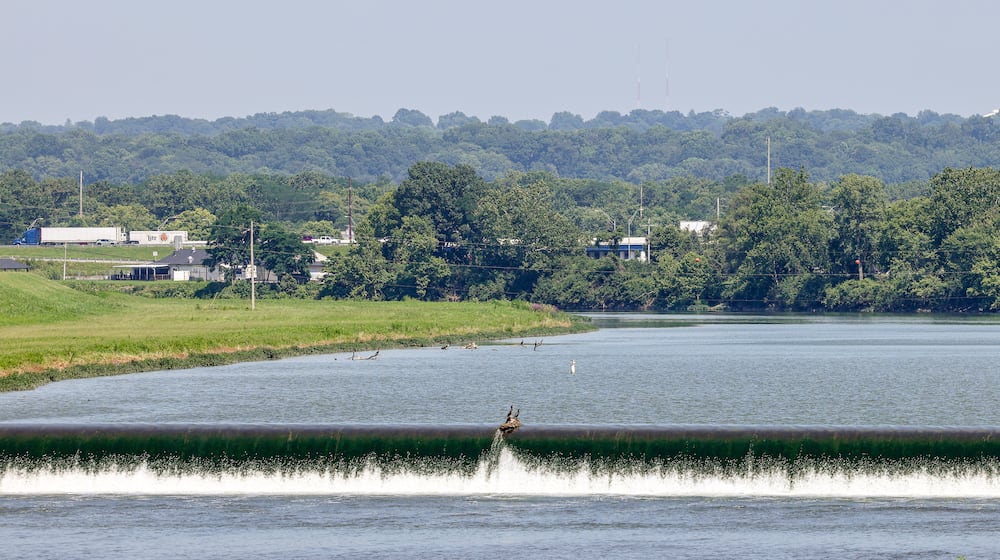 West Carrollton continues to advance plans to develop the area along East Dixie Drive just west of Interstate 75's Exit 47. One key feature of the development will be a whitewater park on the Great Miami River. BRYANT BILLING/STAFF