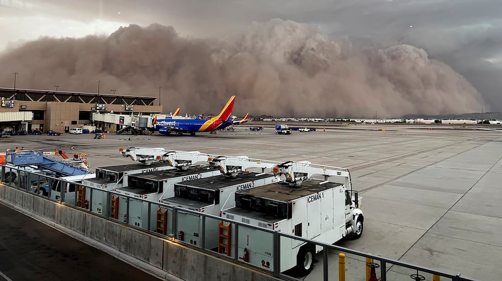 This photo provided by the City of Phoenix shows a towering cloud of dust at Phoenix Sky Harbor International Airport on Monday, Aug. 25, 2025. (City of Phoenix via AP)