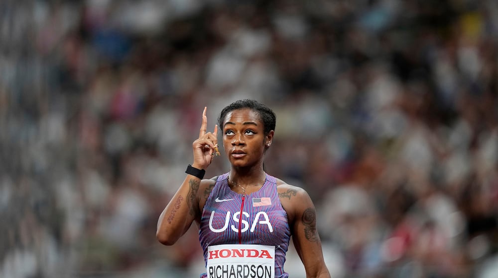 United States' Sha'Carri Richardson gestures after finishing a women's 100 meters heat at the World Athletics Championships in Tokyo, Saturday, Sept. 13, 2025. (AP Photo/Petr David Josek)