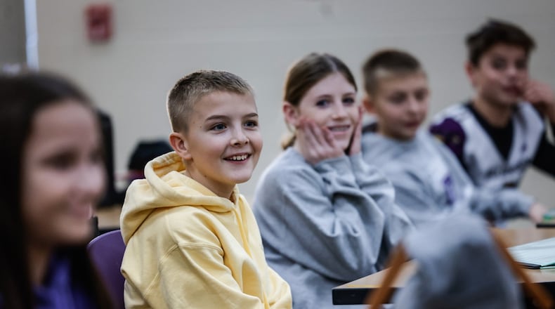Bellbrook Middle School Hope Squad students from left, Ava Kapfhammer, Graeme Smith, Amelia Nichols and Jake Long discuss ideas for future Hope Squad events to help cheer their fellow students up. Jim Noelker/ Staff