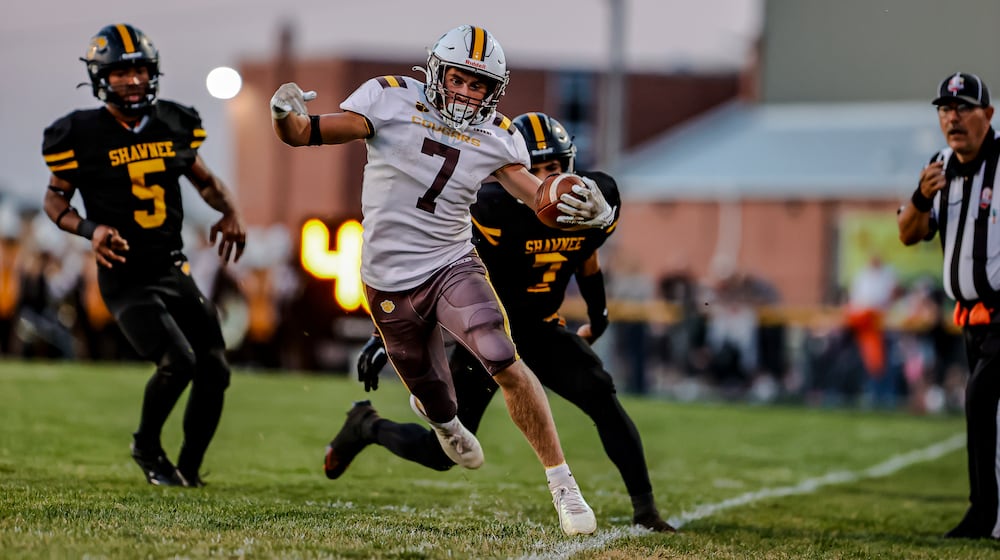 Kenton Ridge High School junior Brody Runkle tip toes the sideline during their game at Shawnee on Friday, Sept. 12 in Springfield. The Cougars won 42-14. MICHAEL COOPER/STAFF PHOTO