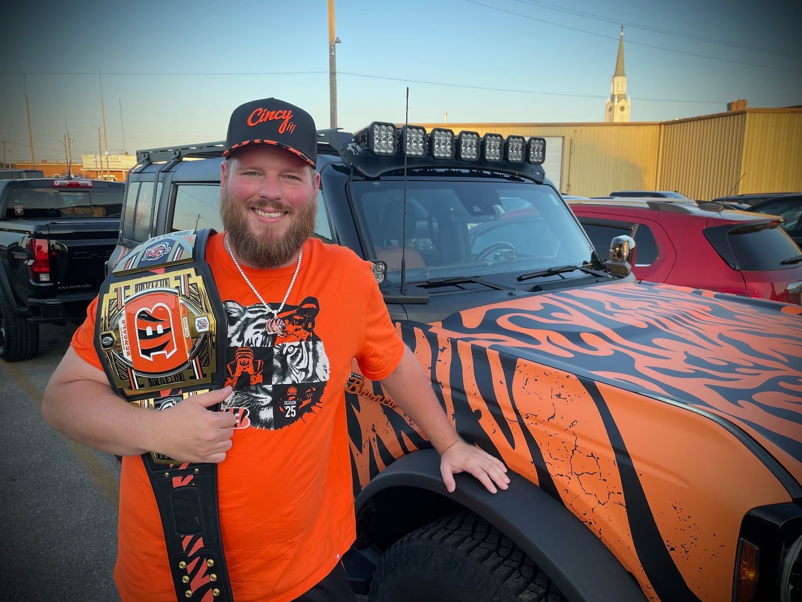 Adam Bushman of New Bremen drove his 2022 Ford Bronco that is decked out in tiger stripes about an hour to the Troll Pub to hangout with other Bengals fans. NATALIE JONES/STAFF