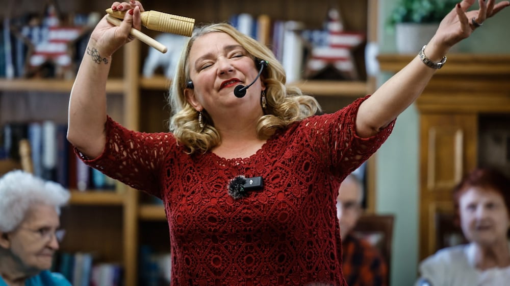 Community Gem Krissy O'Malley sings and dances with the residence of Brookdale Centennial Park Senior Living. O'Malley is the owner and founder of Senior Music Connection. JIM NOELKER/STAFF