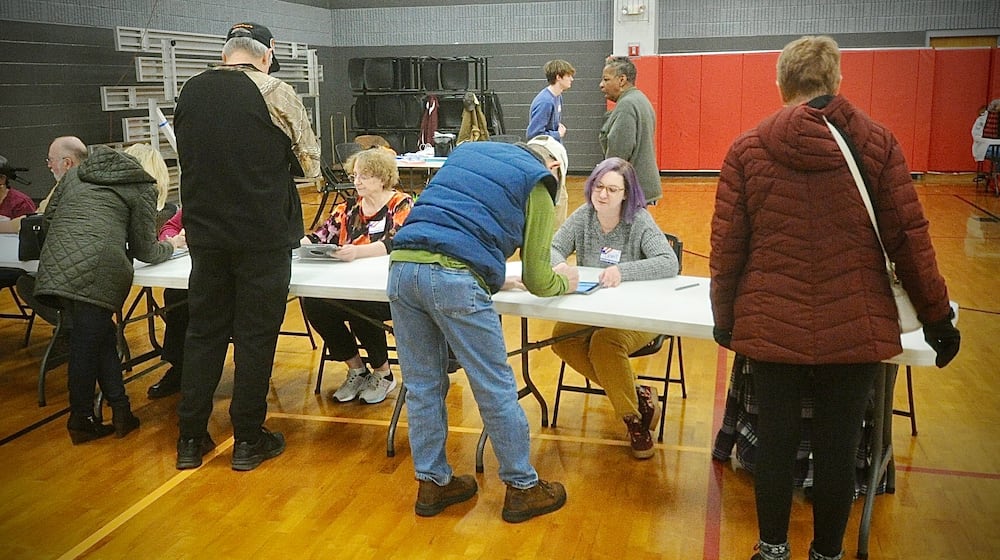 Voters sign in to vote at the Xenia Community Center, Tuesday March 19, 2024. MARSHALL GORBY \STAFF