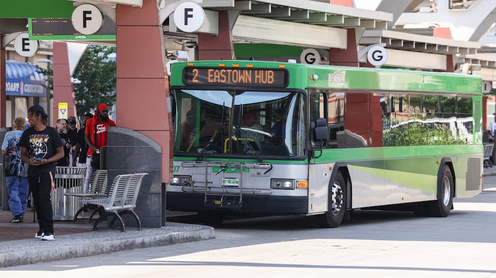 Passengers enter a Greater Dayton RTA bus at Wright Stop Plaza Transit Center on Friday, June 27. BRYANT BILLING / STAFF