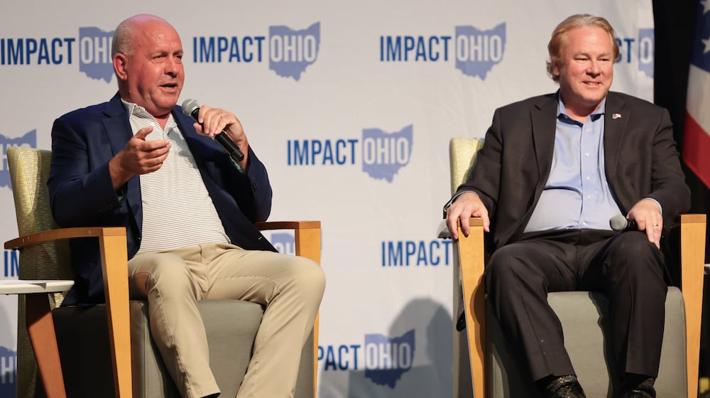 Rep. Dave Taylor (R-Amelia) speaks while U.S. Rep. Warren Davidson (R-Troy) listens during the Ohio Chamber's 2025 Dayton Regional Impact Ohio Conference on Tuesday, Aug. 26, in the Apollo Room in the Student Union at Wright State University. BRYANT BILLING / STAFF