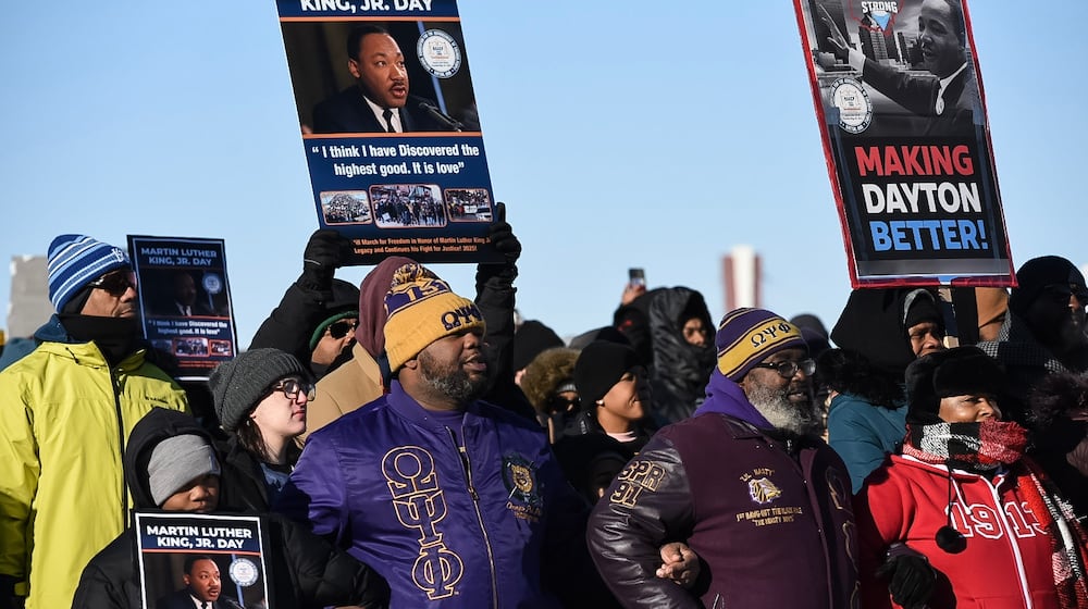 Daytonians gathered to honor Dr. Martin Luther King Jr. at the annual MLK Day Memorial March on Monday, Jan. 20, 2025, amid sub-zero wind chills. The march started at the Drew Health Center on W. Third St. through the Wright Dunbar Business District and concluded on the Dayton Peace Bridge. TOM GILLIAM / CONTRIBUTING PHOTOGRAPHER