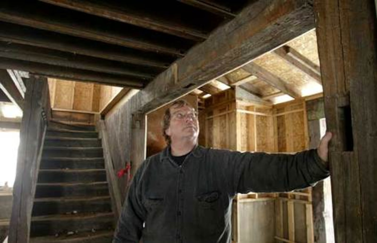 Peerless Mill owner Gary Wiegele stands near a stairway dating well back into the 1800s that was not destroyed during a fire at the Miamisburg restaurant.