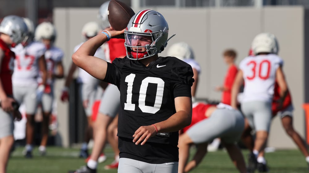 Ohio State quarterback Julian Sayin participates in a drill during NCAA college football practice in Columbus, Ohio, Friday, Aug. 1, 2025. (AP Photo/Paul Vernon)