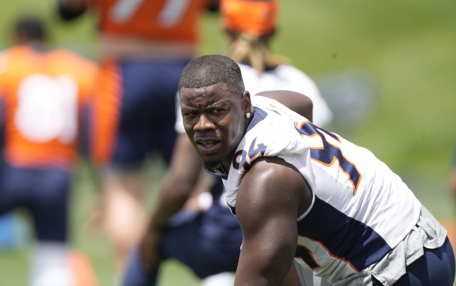 Meadowdale grad and Denver Broncos outside linebacker Aaron Patrick takes part in drills at the NFL football team's headquarters Monday, June 6, 2022, in Centennial, Colo. (AP Photo/David Zalubowski)