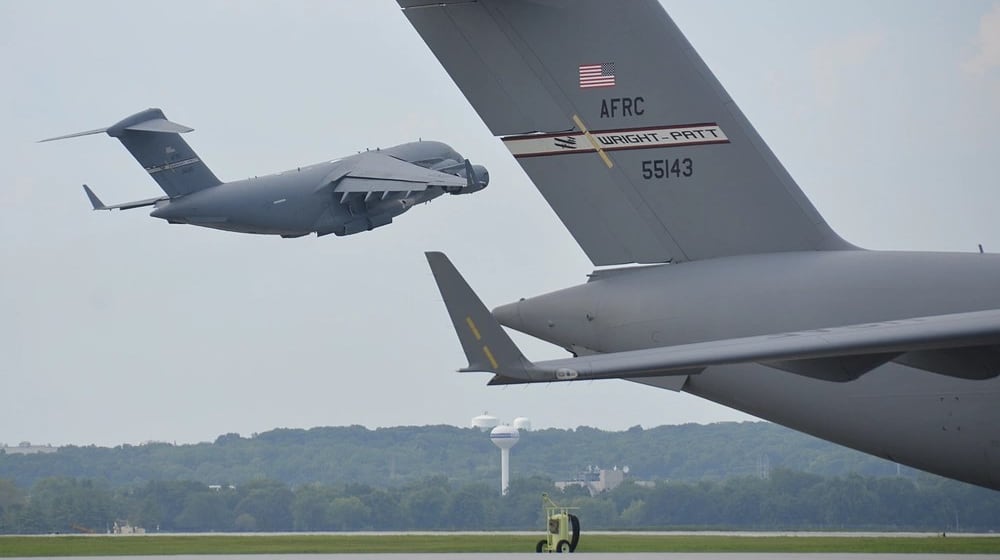 A C-17 Globemaster III aircraft takes off from a runway on August 15, 2020, at Wright Patterson Air Force Base. This particular C-17 is part of the 445th Airlift Wing, home to nine C-17s and nearly 2,000 Reserve Citizen Airmen. (U.S. Air Force photo by Staff Sgt. Ethan G. Spickler)