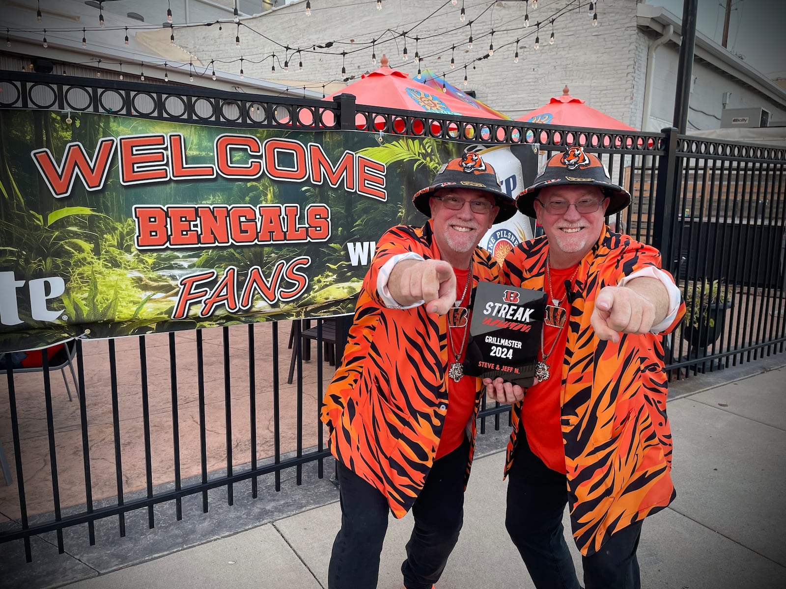 The Cincinnati Bengals hosted an Open in Orange happy hour at the Troll Pub in downtown Dayton on Thursday, Sept. 11. Pictured is Steve and Jeff Nagel, otherwise known as “The Bengals Twins of Dayton, Ohio." NATALIE JONES/STAFF