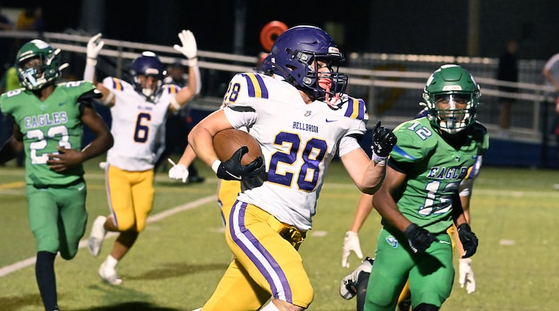 Bellbrook High School freshman Bryce Elmeier runs past Chaminade Julienne sophomore Kayden Greene-Paschal during their 41-0 over the Eagles on Friday night at Roger Glass Stadium in Dayton. NICK FALZERANO/CONTRIBUTED PHOTO