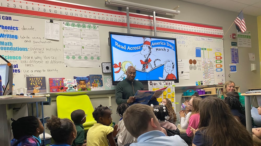 David Lawrence, Dayton Public Schools superintendent, reads to first-graders at Cleveland Elementary on Friday, March 1. Eileen McClory/ Staff
