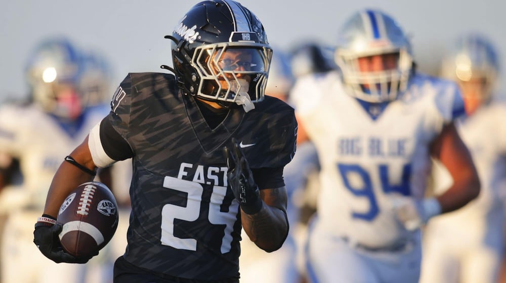 Lakota East running back Ryder Hooks scampers for a long touchdown run against Hamilton on Friday night at Lakota East. NICK GRAHAM / STAFF