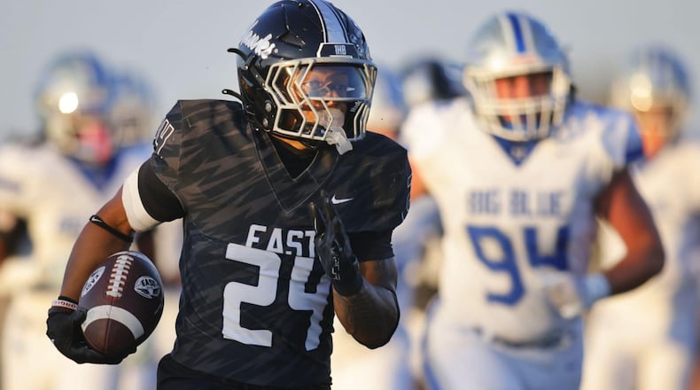 Lakota East running back Ryder Hooks scampers for a long touchdown run against Hamilton on Friday night at Lakota East. NICK GRAHAM / STAFF