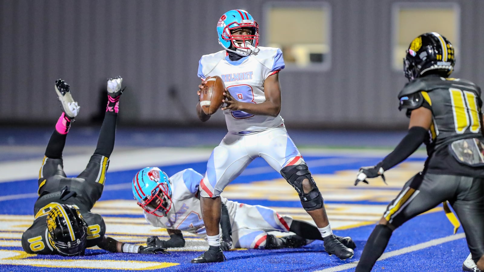 Belmont sophomore quarterback Aaron Dandrea (8) prepares to throw a pass during their game against Meadowdale last season at Welcome Stadium on Oct. 23, 2024. The Lions won 22-2. MICHAEL COOPER/CONTRIBUTED