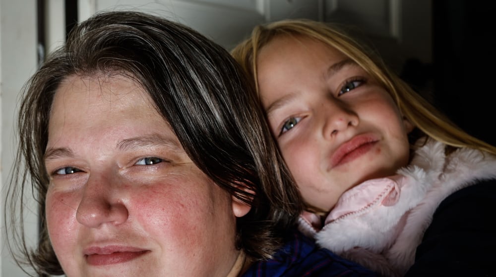 Sarah Lewis and daughter Amelia Miller, both of Troy, faced challenges accessing mental health care for Amelia. JIM NOELKER/STAFF