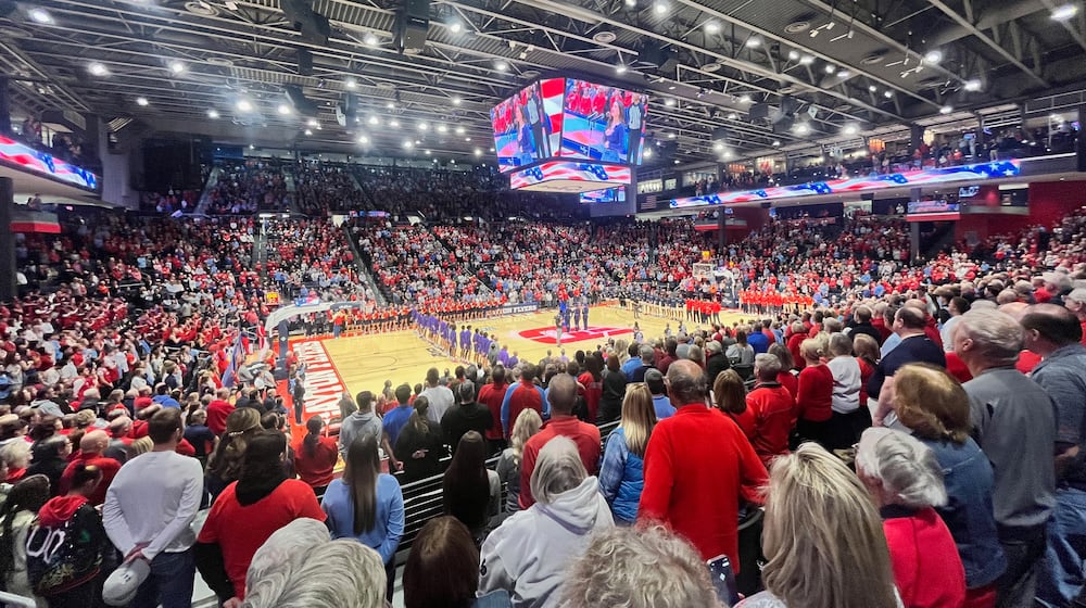 Dayton fans stand for the national anthem before a game against Capital on Saturday, Nov. 16, 2024, at UD Arena. David Jablonski/Staff