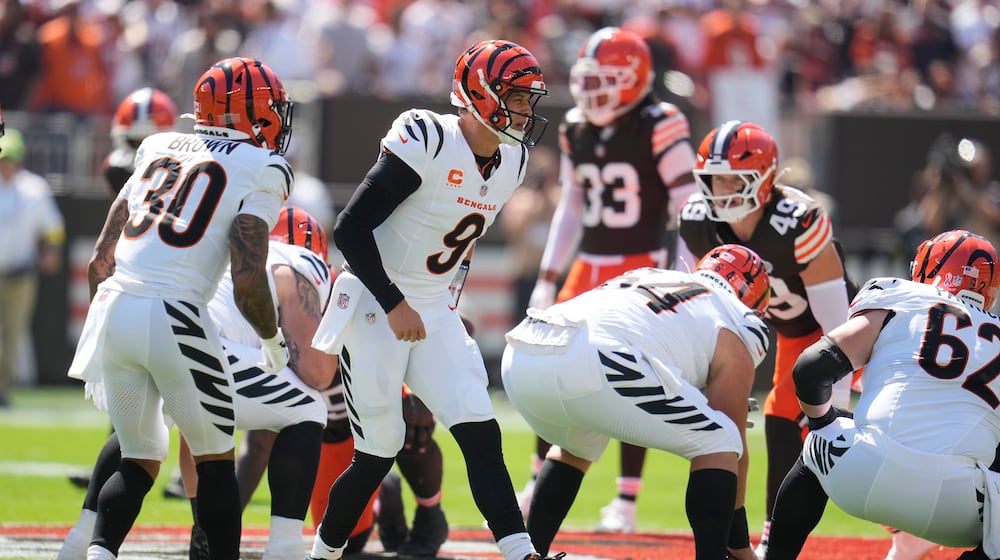 Cincinnati Bengals quarterback Joe Burrow (9) calls a play during the first half of an NFL football game against the Cleveland Browns, Sunday, Sept. 7, 2025, in Cleveland. (AP Photo/Sue Ogrocki)