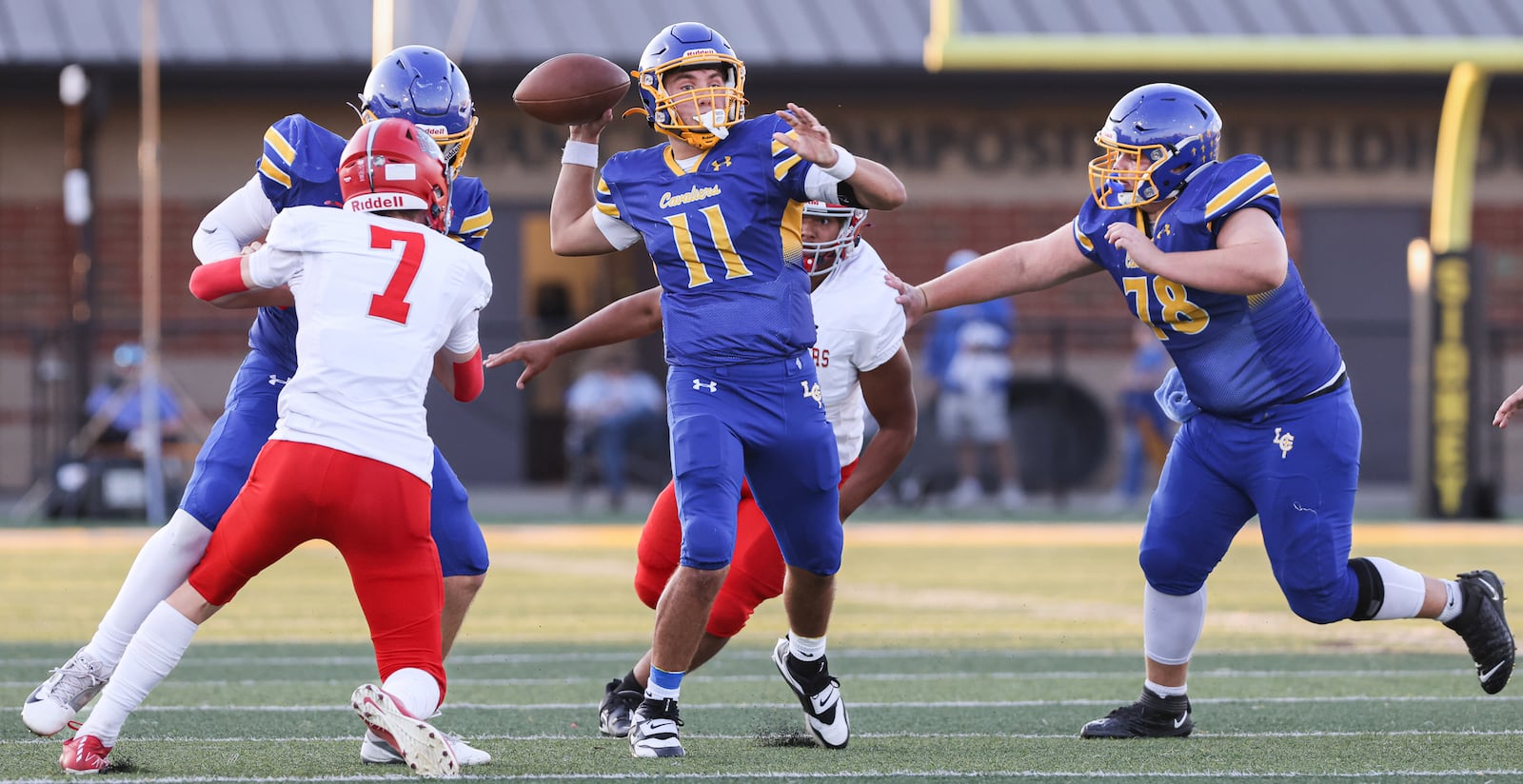 Lehman Catholic senior quarterback Turner Lachey throws during a Three Rivers Conference game against Northridge on Thursday, Sept. 11 at Sidney Memorial Stadium. Lachey has thrown for 20 touchdowns with one interception and about 1,500 yards in the squad's first four games. BRYANT BILLING / STAFF