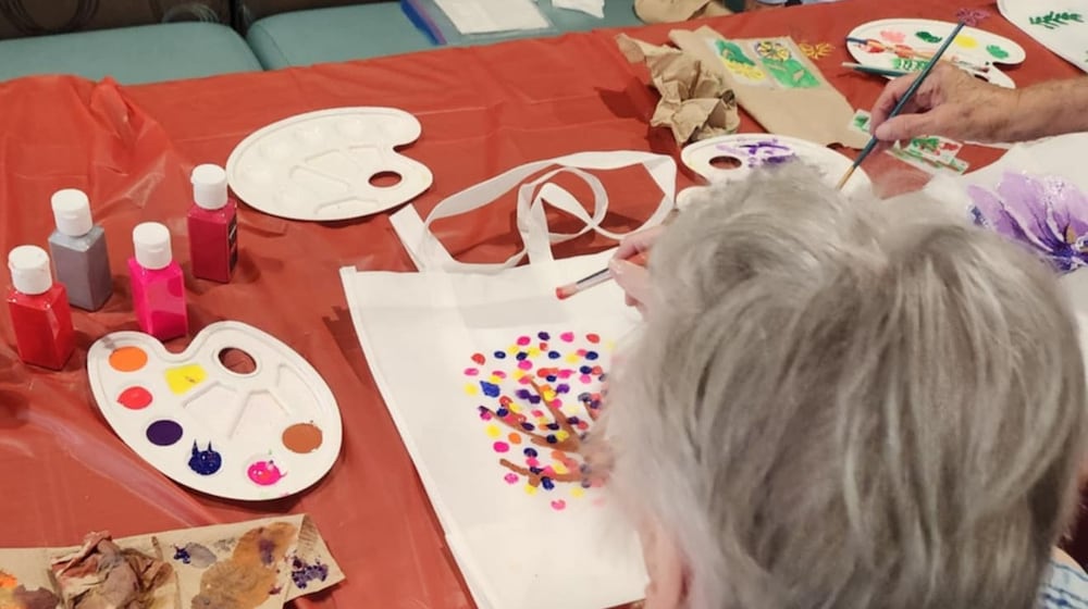 A resident of the Traditions of Beavercreek  participates in one of the many group activities designed to stimulate the mind. SUBMITTED