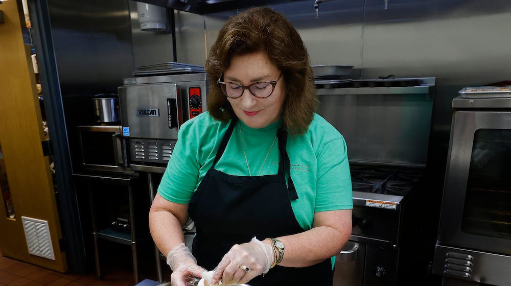 Community Gem, Amy Rollins, is the Miracle Club co-founder and a Goodwill Easter Seals Miami Valley volunteer. MARSHALL GORBY\STAFF