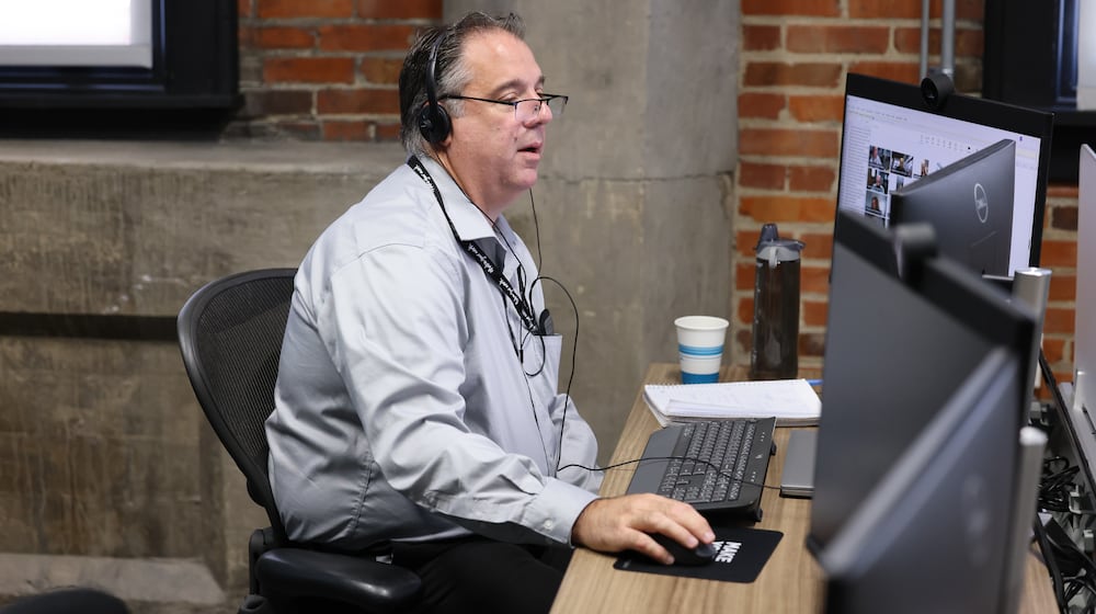 Dayton Daily News reporter Michael Kurtz works a desk in the paper's office in downtown Dayton on Thursday, Sept. 11. BRYANT BILLING / STAFF