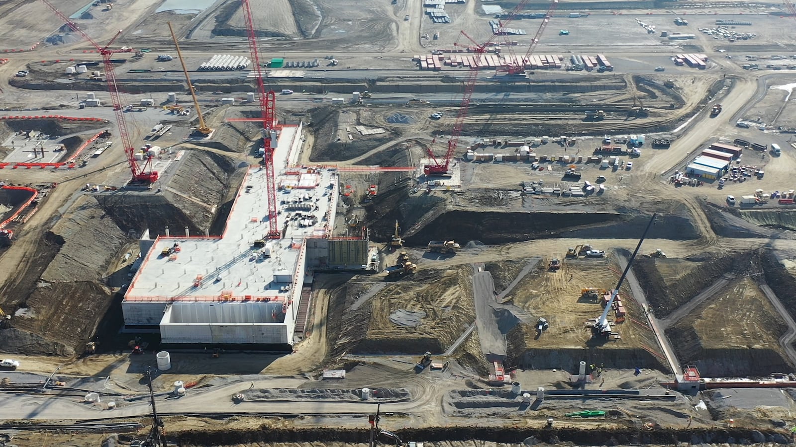 An aerial view from February 2024 shows construction progress at Intel's Ohio One campus in New Albany, Ohio. The company is investing $28 billion to build two semiconductor fabrication plants on the site, which spans nearly 1,000 acres. The company broke ground in September 2022. (Credit: Intel Corporation)