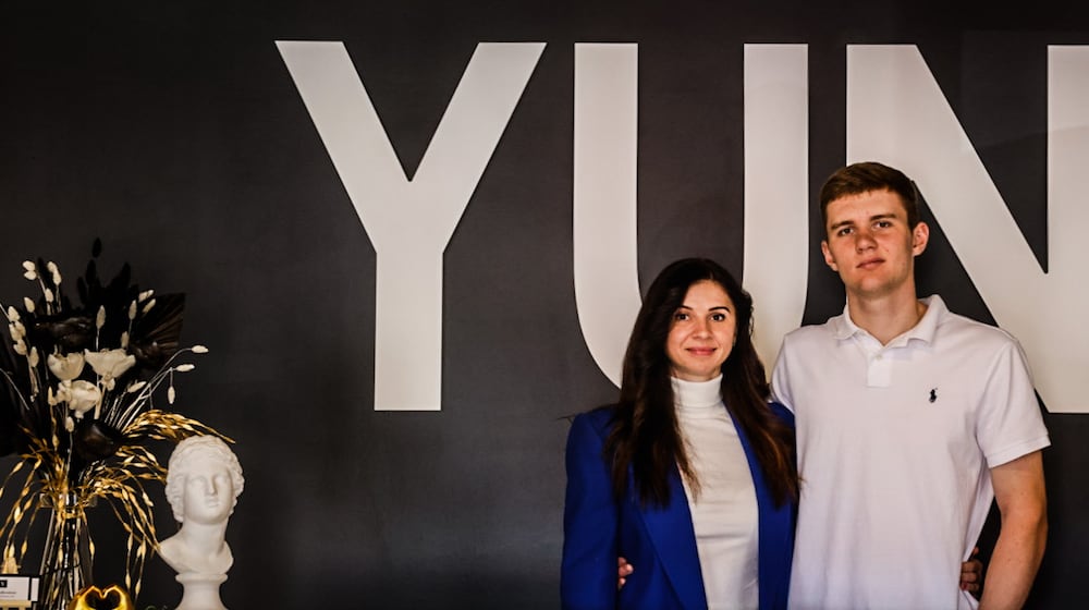 Yuliia Kovalenko and her son, Nikolay Korzh, fled Ukraine because of the country's war with Russia. Kovalenko started YUNI Creative Tailoring on Far Hill Avenue in Centerville. JIM NOELKER/STAFF