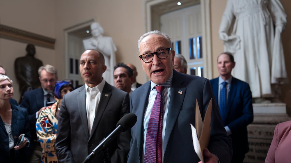 Senate Minority Leader Chuck Schumer, D-N.Y., joined at left by House Minority Leader Hakeem Jeffries, D-N.Y., speaks to reporters after meeting about Republican efforts to cut health care spending, at the Capitol in Washington, Thursday, Sept. 11, 2025. (AP Photo/J. Scott Applewhite)